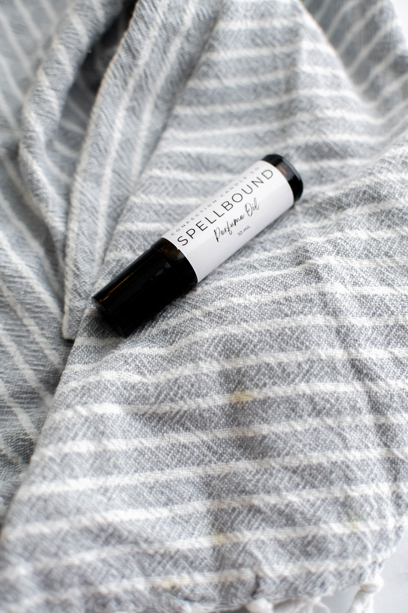 Amber glass roller bottle of perfume oil.