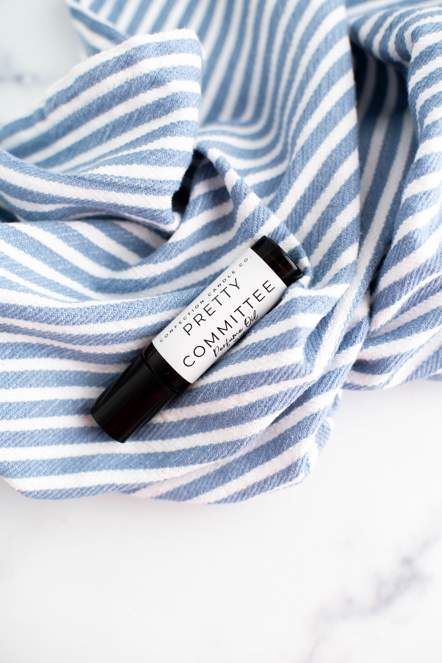 Amber glass roller bottle of perfume oil.