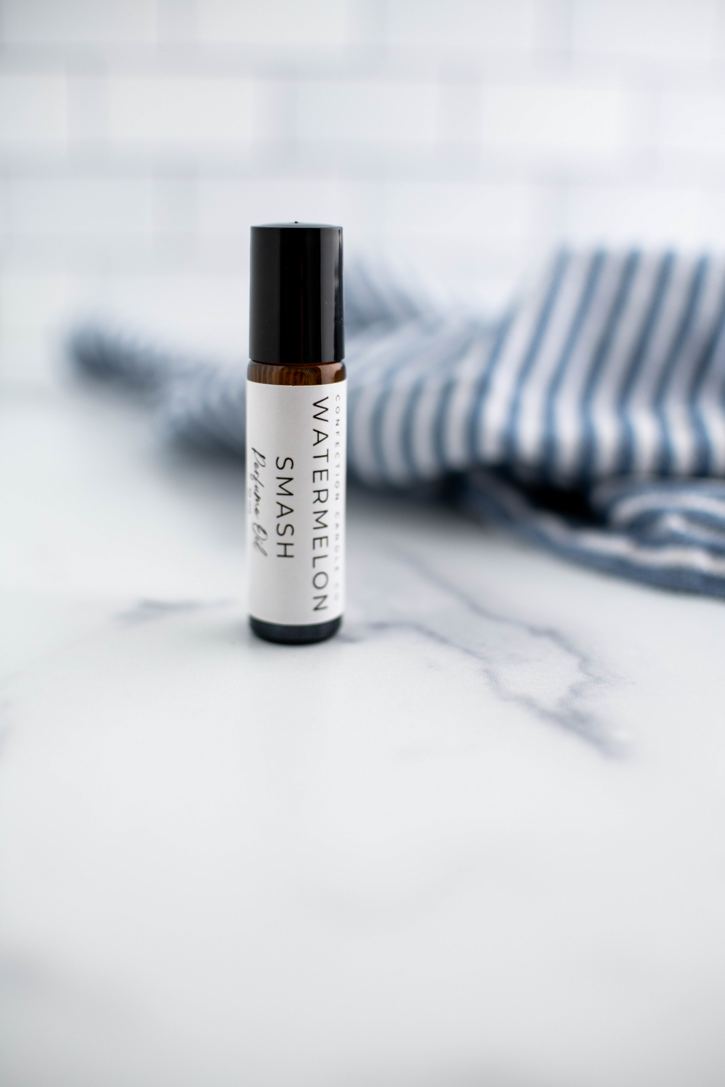 Amber glass roller bottle in the fragrance Watermelon Smash.