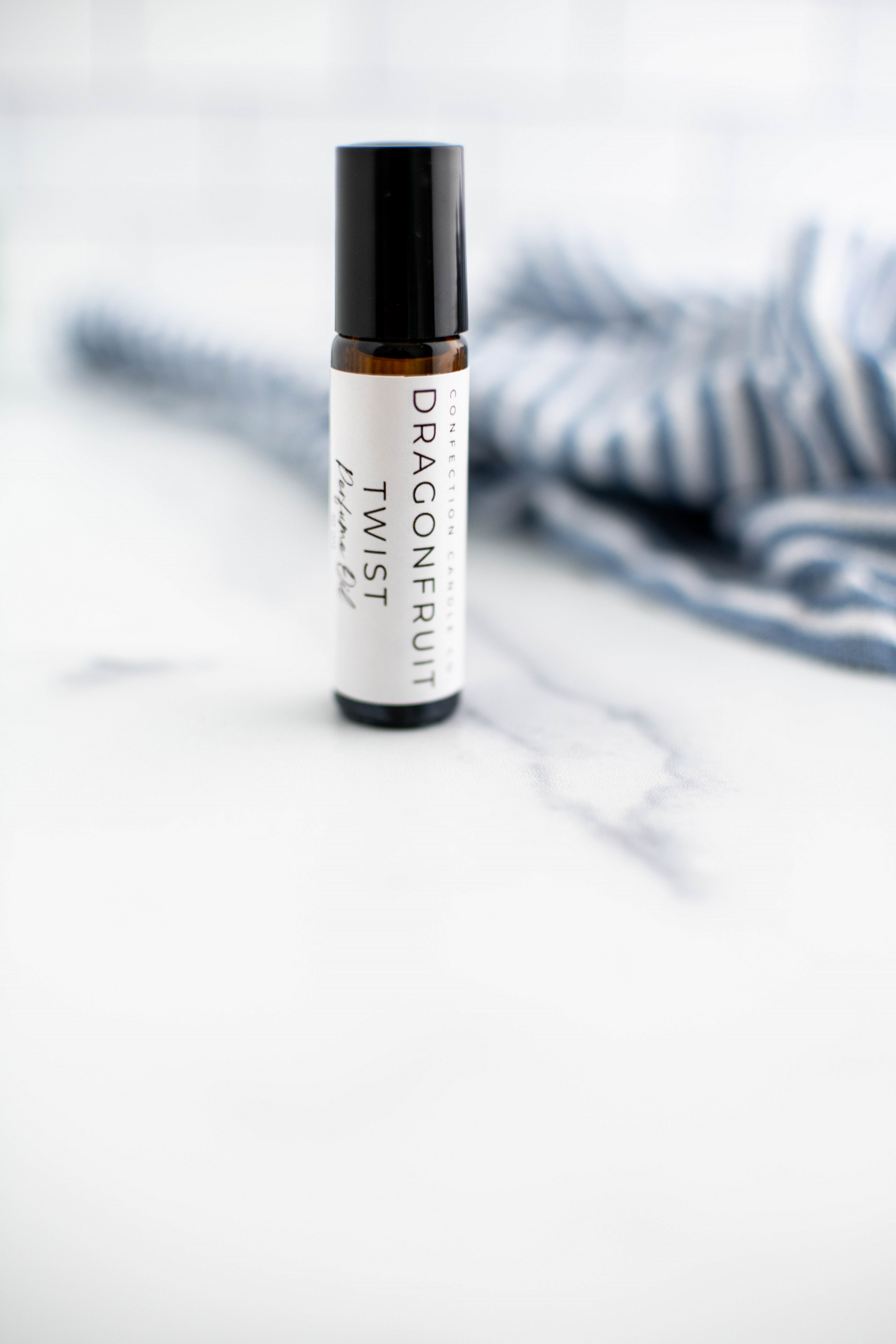 Amber glass roller bottle in the fragrance Dragonfruit Twist.