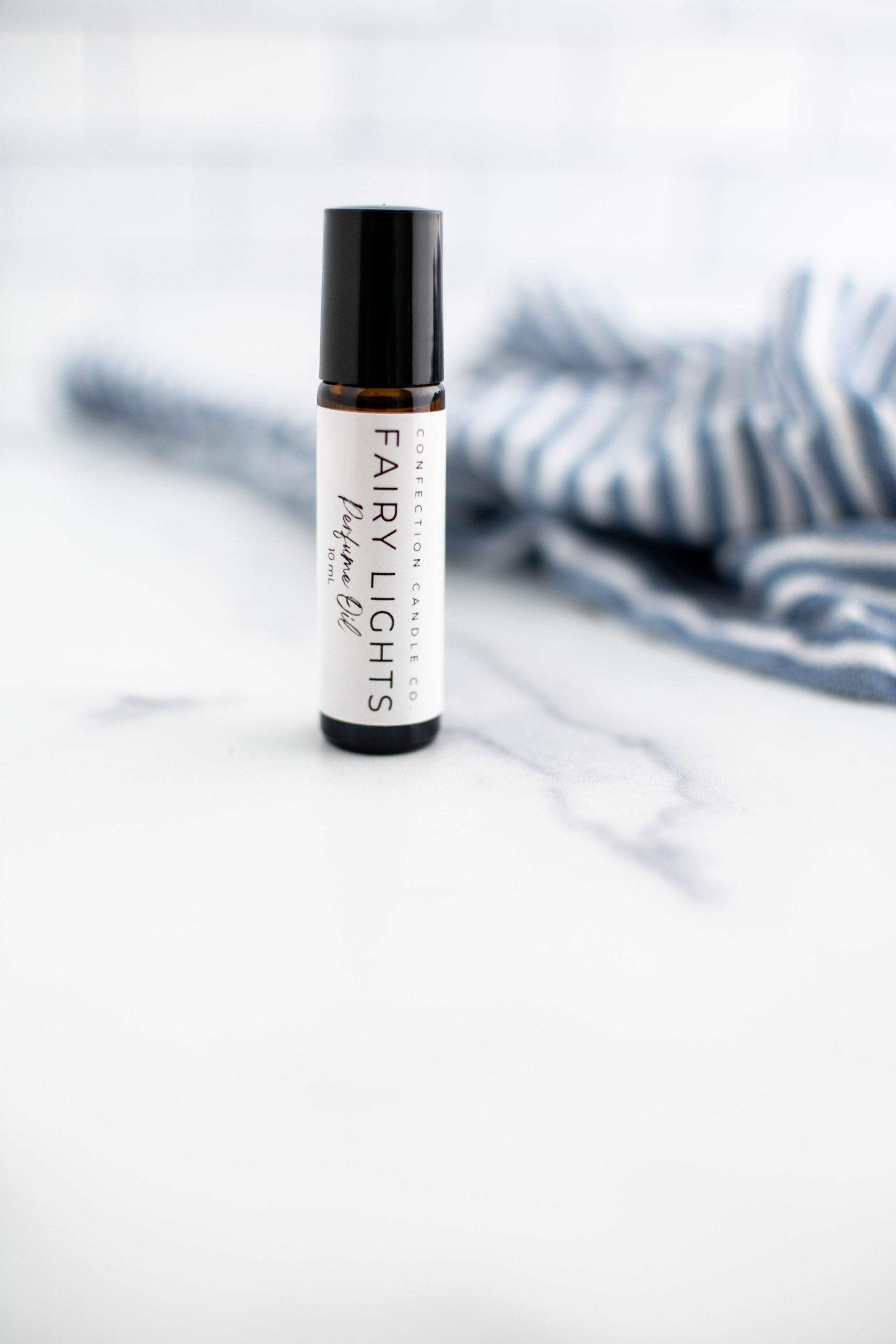 Amber glass roller bottle in the fragrance Fairy Lights.